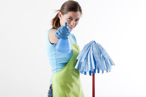 Cleaner using safe practices in a workplace setting