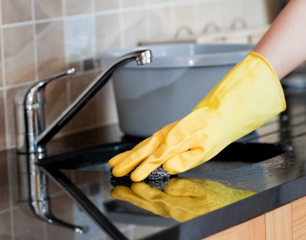 Westkensington Cleaners team using protective equipment during a safe cleaning task